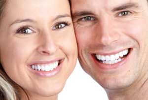 picture of a couple smiling with perfect teeth